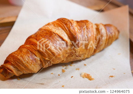 fresh baked croissant on plate with copy space  124964075