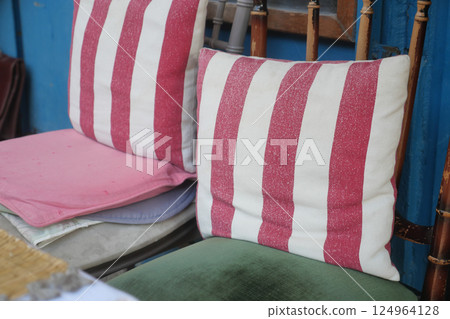 Vibrantly Colorful Cushions Placed on Vintage Chairs for an Inviting Look 124964128