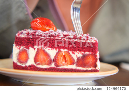 Enjoy a delightful slice of Delicious Red Velvet Strawberry Layer Cake, perfect for any occasion Enjoy a delightful slice of Delicious Red Velvet Strawberry Layer Cake, perfect for any occasion 124964170
