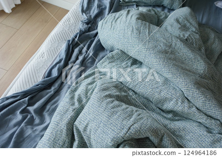 messy bed in early morning , messy bed after waking up messy bed in early morning , messy bed after waking up 124964186