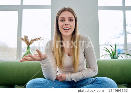 Web cam view of young woman talking looking in camera, online meeting, video call Web cam view of young woman talking looking in camera, online meeting, video call 124964562