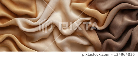 Golden beige fabric with soft folds and drapery texture. Close-up textile background. Design for wallpaper, fashion, interior, print, banner. 124964836