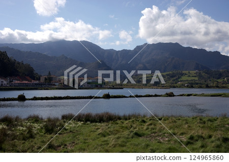 Stunning view of river wetlands and mountains in Ribadesella, Asturias, Spain, on a sunny day 124965860