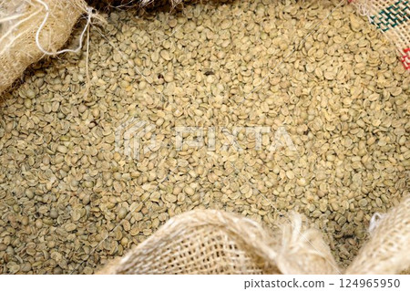 Coffee factory, roasting coffee in a machine in a factory Coffee factory, roasting coffee in a machine in a factory 124965950