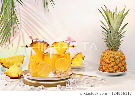 Various cocktails with pieces of mango, pineapple and ice in glasses with rims and umbrellas. Concept of tropical party and relaxation. Advertising business card for bar and restaurant menu 124966112
