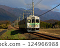 Old train running through the countryside 124966988