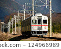 Old train running through the countryside 124966989