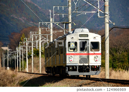 Old train running through the countryside 124966989