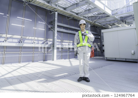 Portrait of a young female worker on the roof of a building. Photo courtesy of Tokyo Electronics College, Denpa Gakuen Corporation. Portrait of a young female worker on the roof of a building. Photo courtesy of Tokyo Electronics College, Denpa Gakuen Corporation. 124967764