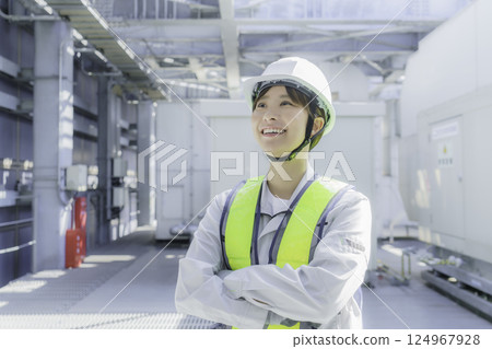 A young female worker carrying out inspection work on the roof of a building. Photo courtesy of Tokyo Electronics College, Denpa Gakuen Corporation. A young female worker carrying out inspection work on the roof of a building. Photo courtesy of Tokyo Electronics College, Denpa Gakuen Corporation. 124967928