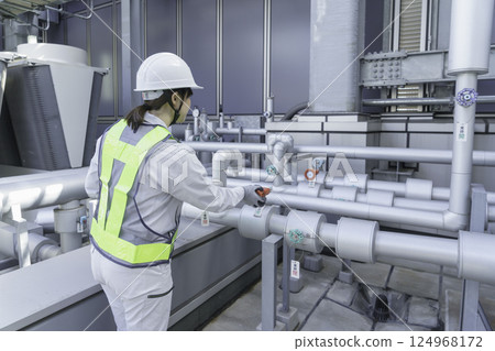 A young female worker carrying out inspection work on the roof of a building. Photo courtesy of Tokyo Electronics College, Denpa Gakuen Corporation. A young female worker carrying out inspection work on the roof of a building. Photo courtesy of Tokyo Electronics College, Denpa Gakuen Corporation. 124968172