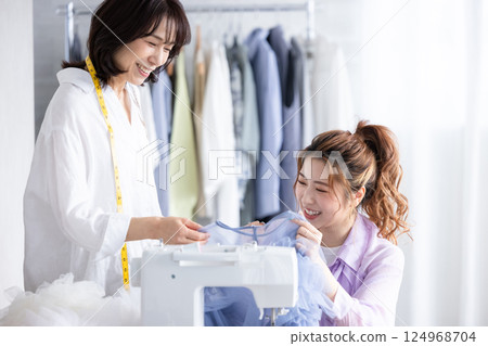 Sewing machine sewing woman Sewing machine sewing woman 124968704