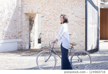 Woman riding a bicycle 124968716