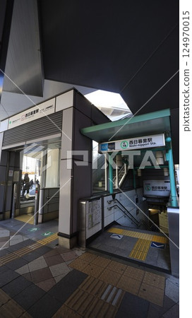 Exit 2 of Nishi-Nippori Station on the Tokyo Metro Chiyoda Line and the exit with the escalator for the Nippori-Toneri Liner 124970015