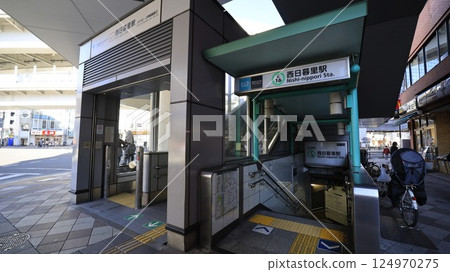 Exit 2 of Nishi-Nippori Station on the Tokyo Metro Chiyoda Line and the exit with the escalator for the Nippori-Toneri Liner 124970275