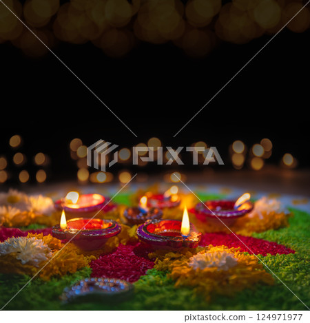 Clay diya lamps lit during diwali celebration, Diwali, or Dipawali, is India's biggest and most important holiday. Clay diya lamps lit during diwali celebration, Diwali, or Dipawali, is India's biggest and most important holiday. 124971977