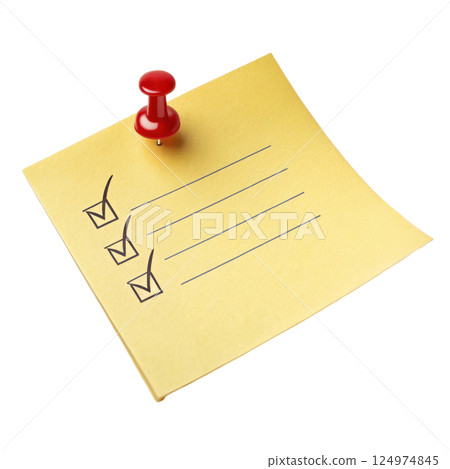 A yellow sticky note with a red push pin attached used to display important information 124974845