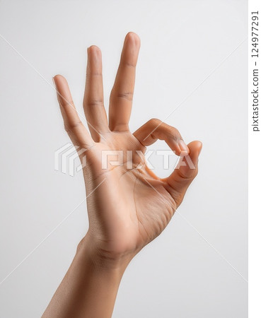 A floating hand making an "OK" gesture on a white background A floating hand making an "OK" gesture on a white background 124977291