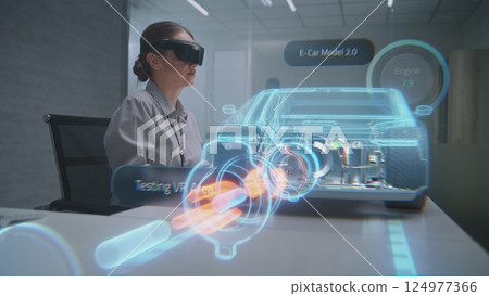 Female Automotive Engineer Uses Augmented Reality Hologram to Create 3D Electric Vehicle 124977366