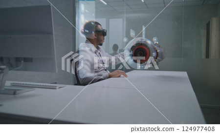 Engineer Uses Augmented Reality Headset to Visualize 3D Model of Renewable Energy Engine 124977408