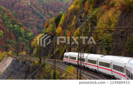 High speed train in autumn scenery in Black Forest, Germany High speed train in autumn scenery in Black Forest, Germany 124980433