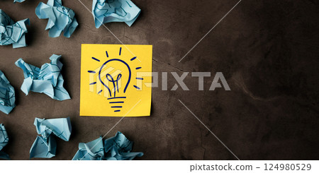 Idea, Innovation and Creativity Concept. a Light Bulb Handdrawn on Sticky Note, Brainstorm for New Business or New Product 124980529