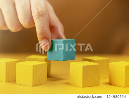 Different, Talent and Outstanding Concept. Hand Picking a Unique Cube that Stand Out among Crowd 124980534