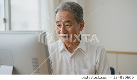 Senior men using a computer 124980609