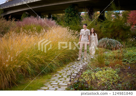 Warm Embrace of Teen Love in the Autumn Park. Capturing Teen Moments: Love Blossoms in Autumn's Embrace. Teenagers in Love: Embracing the Autumn Vibe Warm Embrace of Teen Love in the Autumn Park. Capturing Teen Moments: Love Blossoms in Autumn's Embrace. Teenagers in Love: Embracing the Autumn Vibe 124981840