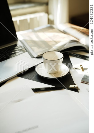 Coffee Cup on Organized Workspace with Laptop Coffee Cup on Organized Workspace with Laptop 124982321