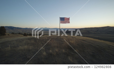 A stunning landscape photograph featuring the American flag proudly waving in the wind. Generative AI A stunning landscape photograph featuring the American flag proudly waving in the wind. Generative AI 124982808