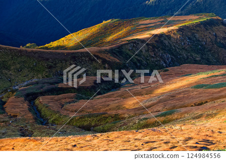 The autumn-colored mountainside seen from Mt. Gonishi in the Iide mountain range The autumn-colored mountainside seen from Mt. Gonishi in the Iide mountain range 124984556
