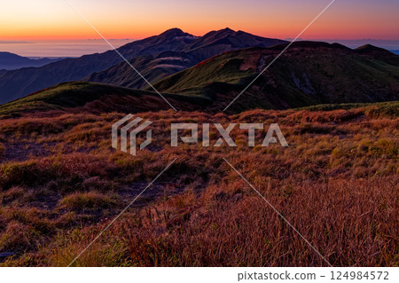 The ridgeline leading to Kitamata-dake in the afterglow seen from Mt. Onishi in the Iide mountain range 124984572