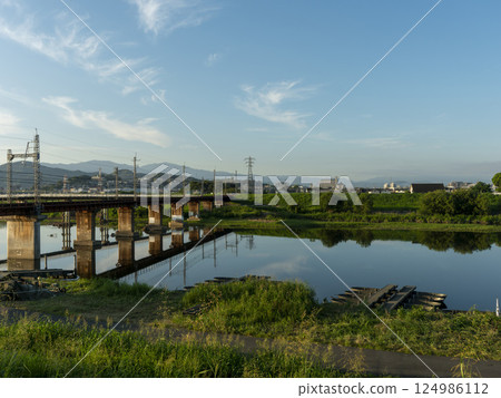 The railway bridge of the Kintetsu Myoji Line across the Yamato River and the Japan Ground Self-Defense Forces during training The railway bridge of the Kintetsu Myoji Line across the Yamato River and the Japan Ground Self-Defense Forces during training 124986112