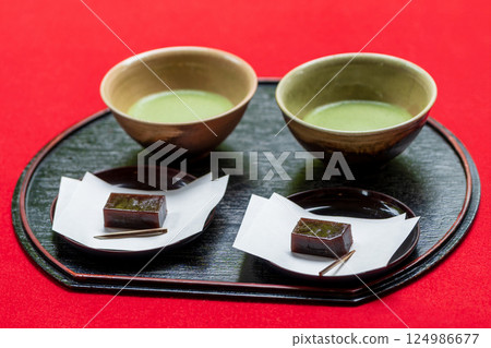 Traditional Japanese tea sweets decorated with matcha and yokan Traditional Japanese tea sweets decorated with matcha and yokan 124986677