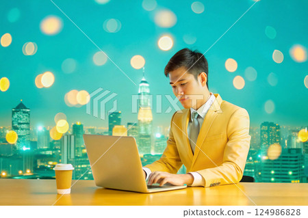 asian businessman working on laptop at night asian businessman working on laptop at night 124986828