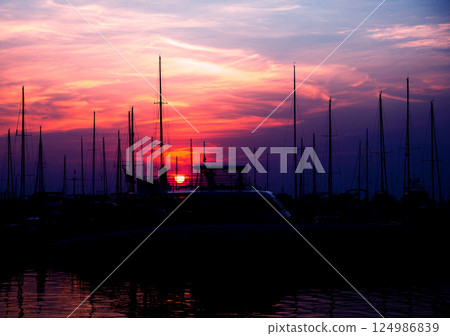 Beautiful view of marina and harbor with yachts and motorboats.  124986839