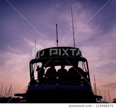 View of harbor with yachts details. Beautiful sunset sky in the marina bay. 124986878
