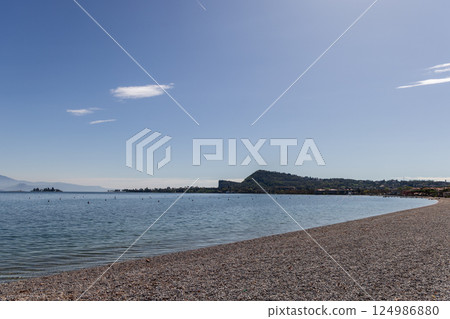 Spring morning on empty Spiaggia Romantica beach at Lake Garda, Italy Spring morning on empty Spiaggia Romantica beach at Lake Garda, Italy 124986880