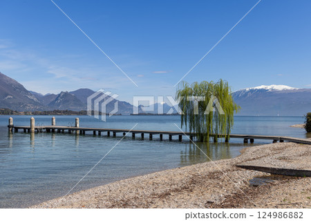 Spring morning view of Lake Garda from Spiaggia Romantica Spring morning view of Lake Garda from Spiaggia Romantica 124986882
