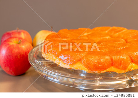 Close-up of apple Tarte Tatin highlighted on neutral background with out of focus apple 124986891