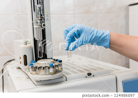 Natural oil quality control. In the industrial laboratory. 124986897