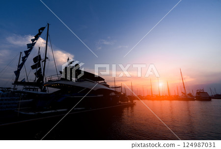 Beautiful view of marina and harbor with yachts and motorboats. Beautiful view of marina and harbor with yachts and motorboats. 124987031