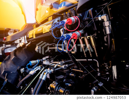 Rear view of modern agricultural tractor. Industrial details. 124987053