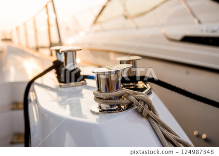 Shining metallic yacht deck details. Daylight background. 124987348