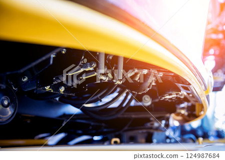 Modern agricultural machinery and equipment. Yellow agricultural harvester. Modern agricultural machinery and equipment. Yellow agricultural harvester. 124987684