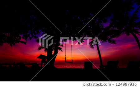 Beautiful tropical beach with palm trees. Sunrises and sunsets. Ocean. 124987936