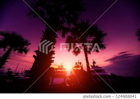 Beautiful sunset sky in the marina bay. View of harbor with yachts Beautiful sunset sky in the marina bay. View of harbor with yachts 124988041