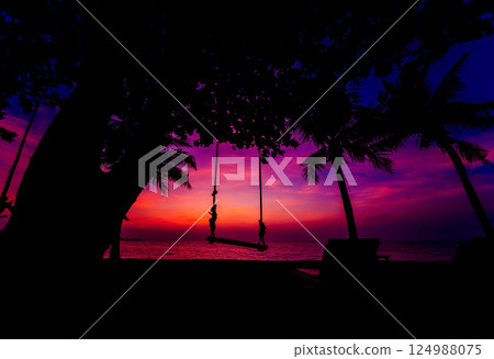 Beautiful tropical beach with palm trees. Sunrises and sunsets. Ocean. Beautiful tropical beach with palm trees. Sunrises and sunsets. Ocean. 124988075