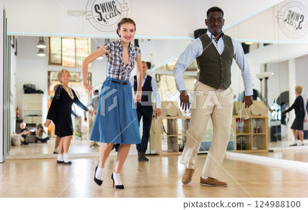 Woman and man dancing swing in studio 124988100